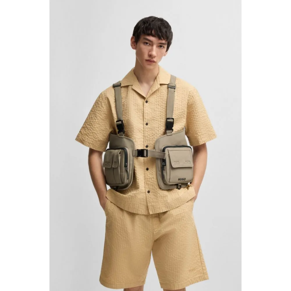 Vest-style backpack with multiple pockets